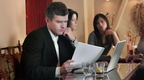 Businessman Reading Reports Stock Footage 9697796