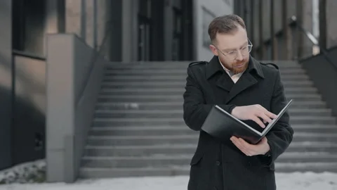 Businessman reading some documents, looking serious. Business people concept. Stock Footage 171549499