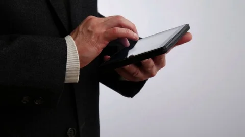 Businessman reading on tablet computer 4 K Video stock 71361330