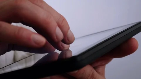 Businessman reading on tablet computer 4 K Video stock 71361863