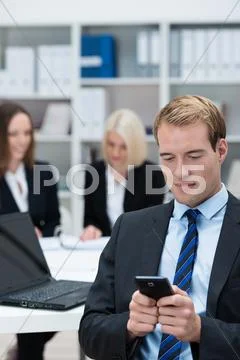 Businessman reading a text message Stock Photos