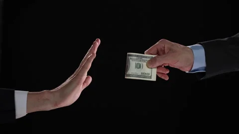 Businessman refusing money offered. Human hands rejecting an offer of money Stock Footage 243144195