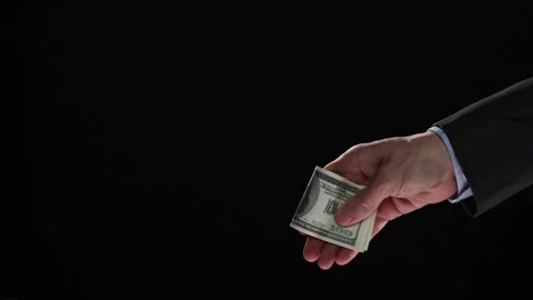 Businessman refusing money offered. Human hands rejecting an offer of money Stock Footage 248025364