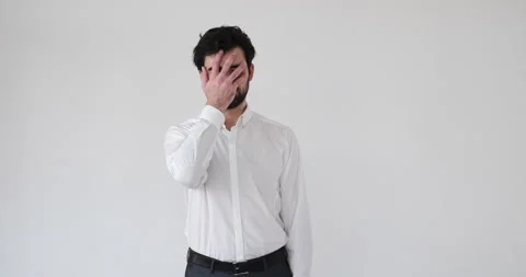 Businessman regretting his wrongdoing over white Stock Footage 133002663