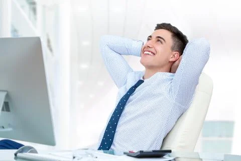 Businessman relaxing in office. Stock Photos