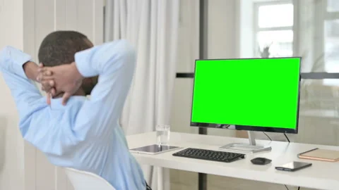 Businessman Resting While Using Desktop with Green Chroma Key Screen Stock Footage 146482305