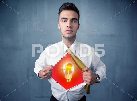 Businessman ripping off shirt and idea light bulb appears Stock Photos