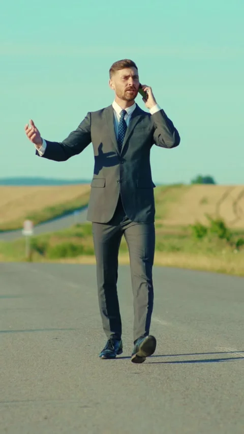 A Businessman on the Road Navigating Modern Challenges and Enhancing Stock Footage 314367353