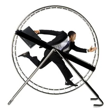 Businessman running in hamster wheel Stock Photos