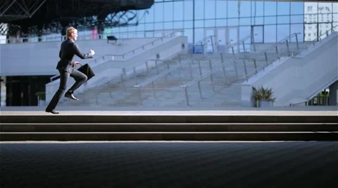 Businessman runs about the business center Stock Footage