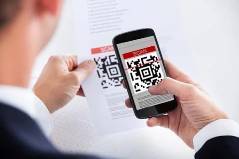 Businessman scanning a barcode 写真素材