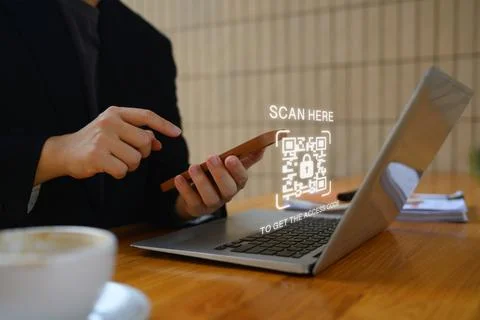Businessman scanning QR code with smart phone for payment and ID verification Stock Photos