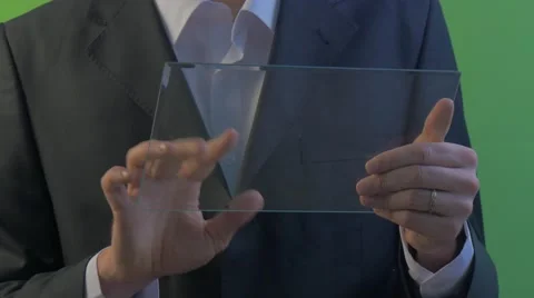 Businessman Scrolls a Screen of Device Holding Virtual Tablet Working on Forex Video stock 61013544