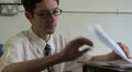 Businessman searches through paperwork HD Footage