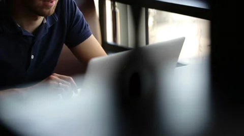 Businessman seated in cafe working with computer Stock Footage 56568254