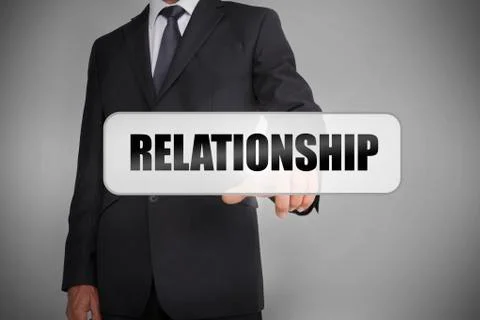 Businessman selecting the word relationship Stock Photos
