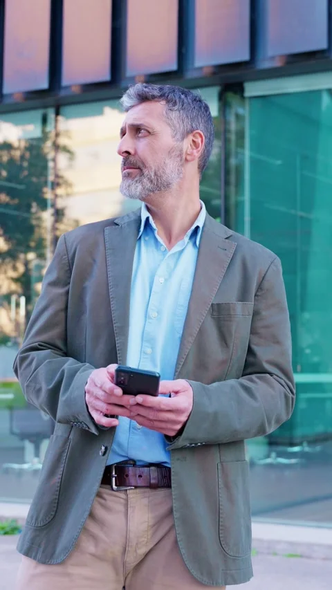 Businessman Shaking Head and Looking Aside While Checking Smartphone.Vertical Stock Footage 293189152