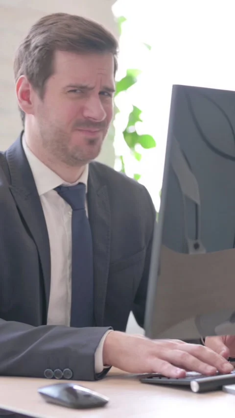 Businessman Shaking Head in Rejection While Using Desktop Computer, vertical Stock Footage 328977665