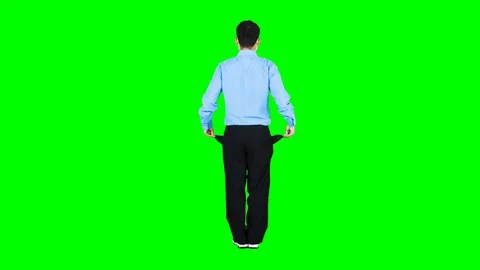 Businessman showing empty pockets and rotating Video stock 130061287