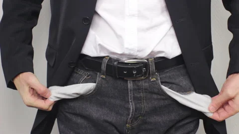 A Businessman showing empty pockets Stock Footage 233474092