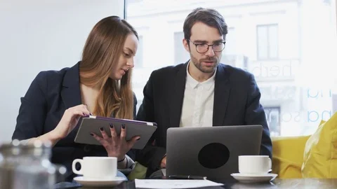 Businessman Showing Something on a Laptop Computer Stock Footage 71606377