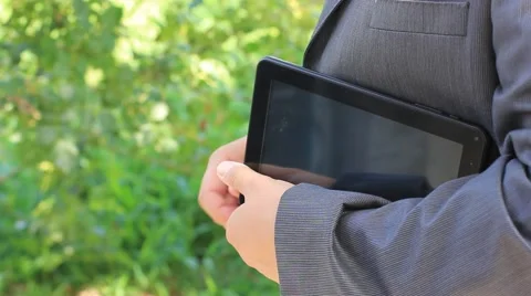 Businessman showing on tablet computer and speaking Stock Footage 44440506