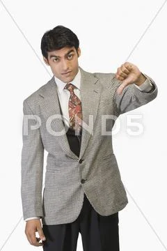 Businessman showing thumbs down Stock Photos