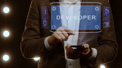 Businessman shows hologram with text Developer Stock Footage 115031898