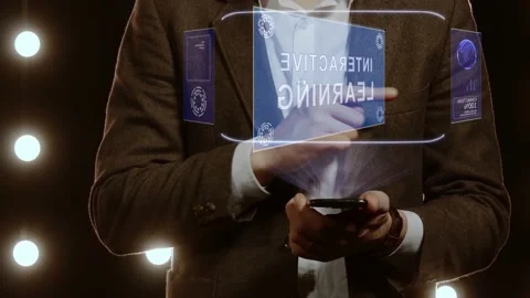 Businessman shows hologram with text Interactive Learning Stock Footage 145751409