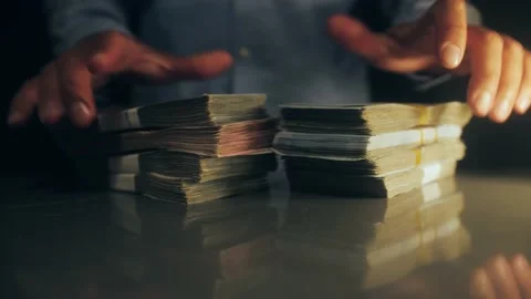 Businessman shows stack of dollars. Bills in the strap. Success man showing a Stock Footage 195511743