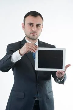 Businessman shows tablet Stockfoto's