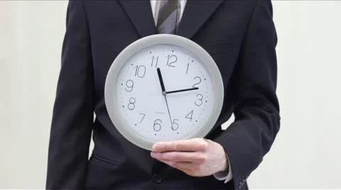 Businessman Shows Time on Clock (white) Stock Footage 12681908