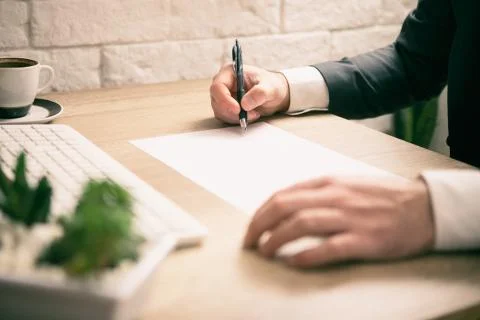 Businessman signing documents Stock Photos