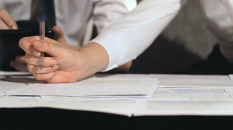 Businessman signs a document at work Stock Footage