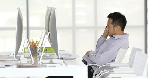 Businessman sit in front of computers. Stock Footage 98962532