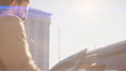Businessman sits in a car Stock Footage 128526166