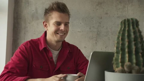 Businessman sitting at desk looking at computer screen talking with friend make Stock Footage 140200221