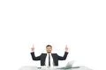 The businessman sitting at the desktop and gesturing on the white background Photo