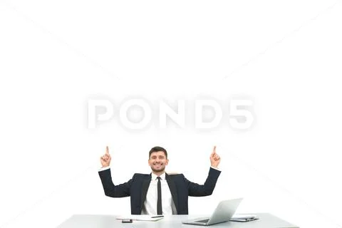 The businessman sitting at the desktop and gesturing on the white background Stock Photos