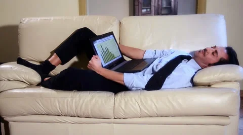 Businessman sleeping on the sofa Stock Footage 33537392
