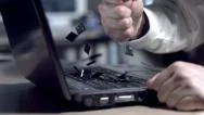 Businessman Smashing Laptop With Fist, Slow Motion Stock Footage