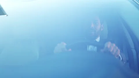 Businessman Smiling Confidently While Driving His Luxury Car in Daytime. Stock-Footage 312663237