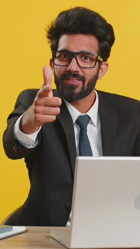 Businessman smiling excitedly, pointing to camera, choosing lucky winner Stock Footage 333459677