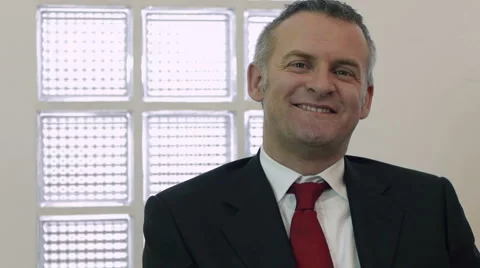 Businessman smiling at work Stock Footage 1181397