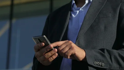 Businessman sms texting using app on smart phone Stock Footage 94078527