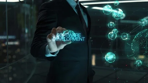 Businessman with Software Development hologram concept Видео 118555227