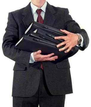 Businessman with stack of folders Stock Photos