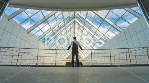 The businessman stand on the bridge in the business center Stock Photos