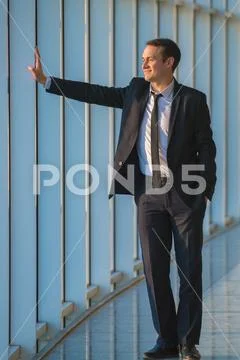 The businessman stand near the panoramic window Stock Photos