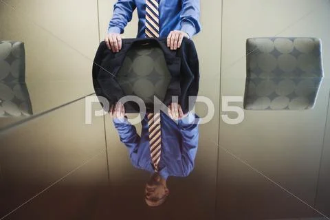 Businessman standing behind conference table Stock Photos